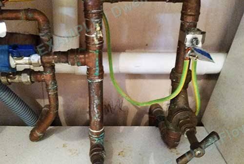 Stop tap and incoming pipe — Under the kitchen sink
